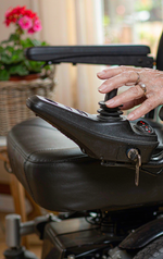 L3 tiller, control panel and elderly rider hand close-up