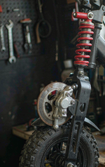 N3LMAX front coil-spring shock absorber and disc brake close-up